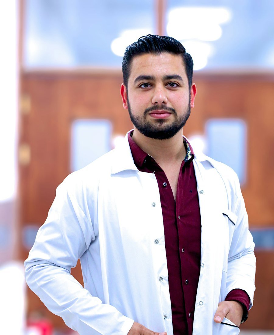 Smiling male doctor in a white coat