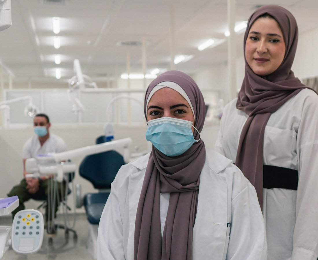 Two female doctors wearing hijab in a modern clinic