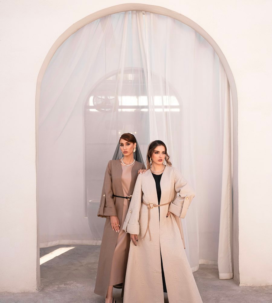 Two women in modern abayas